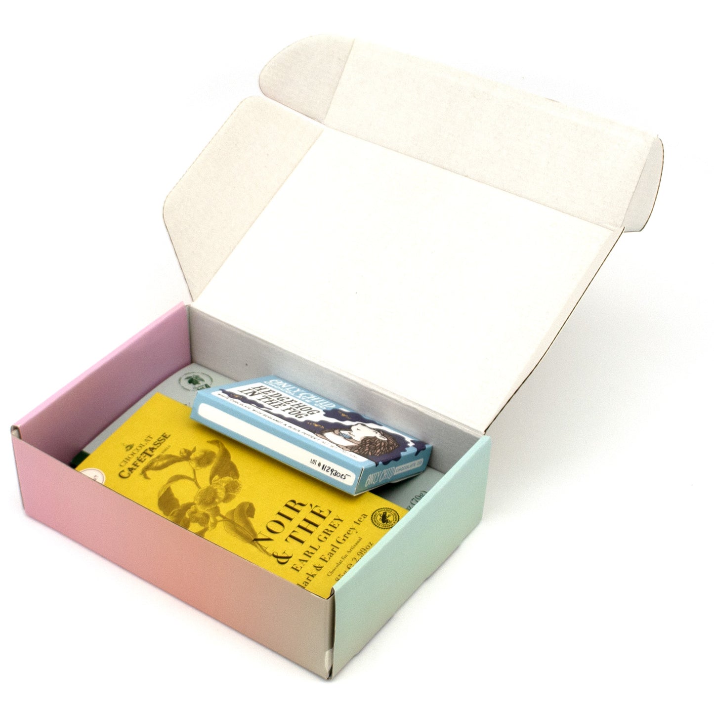 An open pastel-colored gift box containing a 5 wrapped chocolate bars, photographed on a white background.