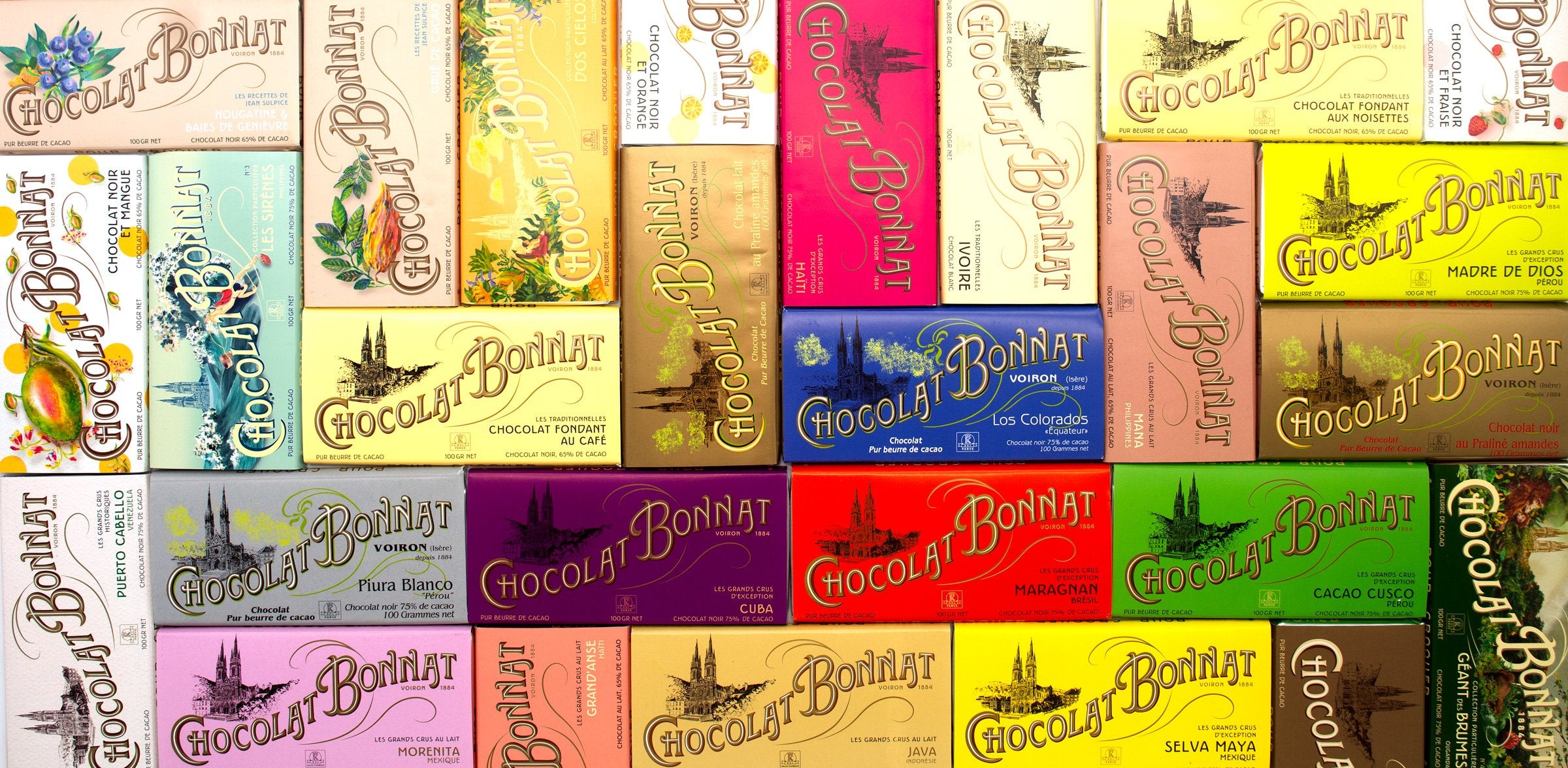 Collection of colorful 'Chocolat Bonhar' boxes arranged in a grid.