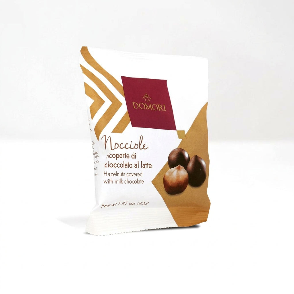 DOMORI chocolate packaging with hazelnuts on a white background
