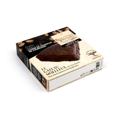 A boxed cake product photographed on a clean white studio background. The package is angled to show the top and side panels, with a large photo of a chocolate cake slice on the front and French text including 'Le Gâteau Molleux'