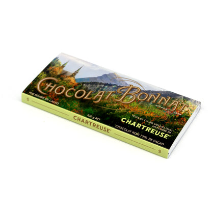 A single wrapped chocolate bar of Chocolat Bonnat Chartreuse, featuring a scenic vineyard landscape illustration on the wrapper with gold lettering, set against a plain white background.