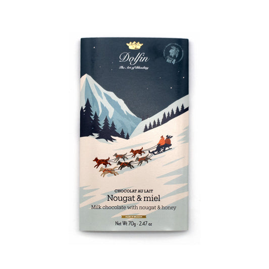 A 70g bar of Doffin Nougat & miel (milk chocolate with nougat and honey) featuring a winter-themed illustration of a sleigh pulled by dogs on a snowy mountain path under a dark night sky.