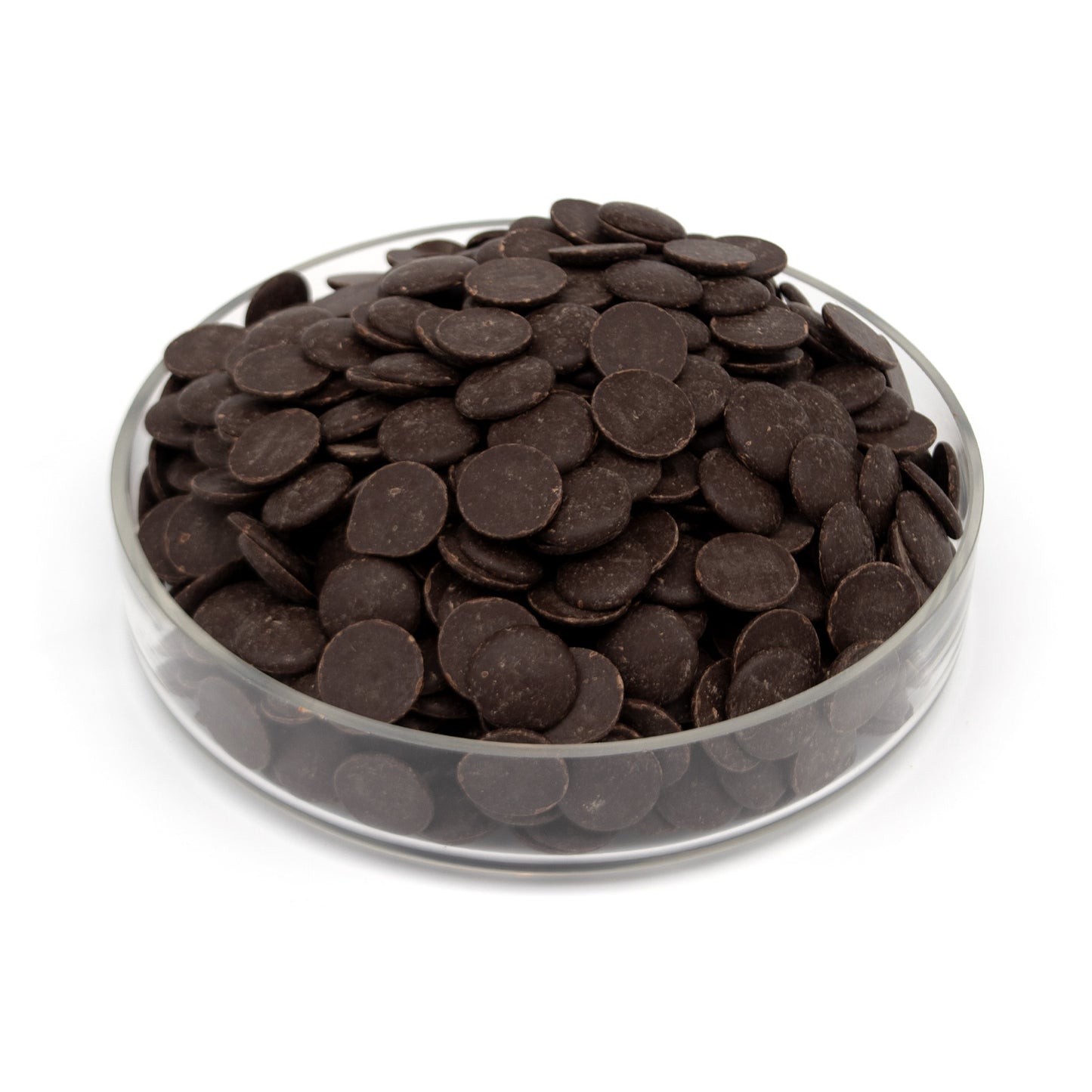 A pile of dark chocolate wafers in a clear glass bowl, photographed on a clean white background.