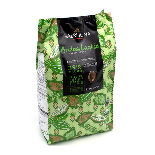 A 3 kg bag of Valrhona Andoa Lactée 39% Cacao chocolate, featuring a green and brown botanical leaf pattern with a central black label.